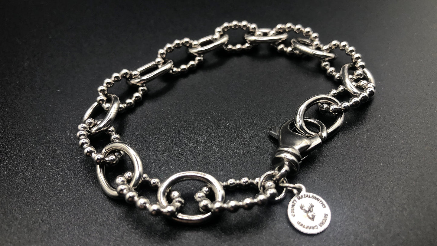 Hand crafted sterling silver oval link bracelet with high polish and beaded links