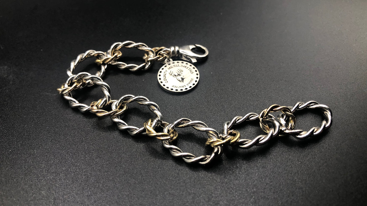 Sterling silver and 1/20 14k twisted oval link bracelet with large charm
