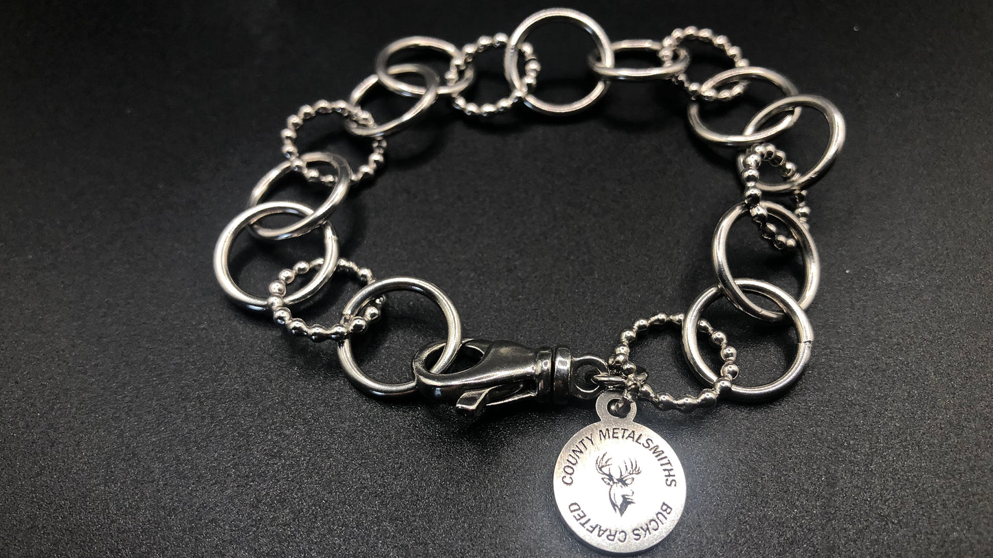 Hand crafted sterling silver high polished and beaded round link bracelet
