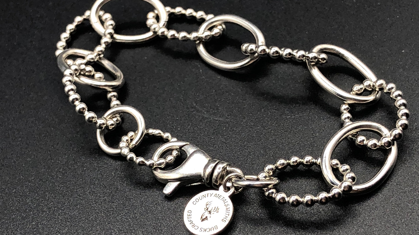 Hand crafted sterling silver high polished and beaded large oval link bracelet
