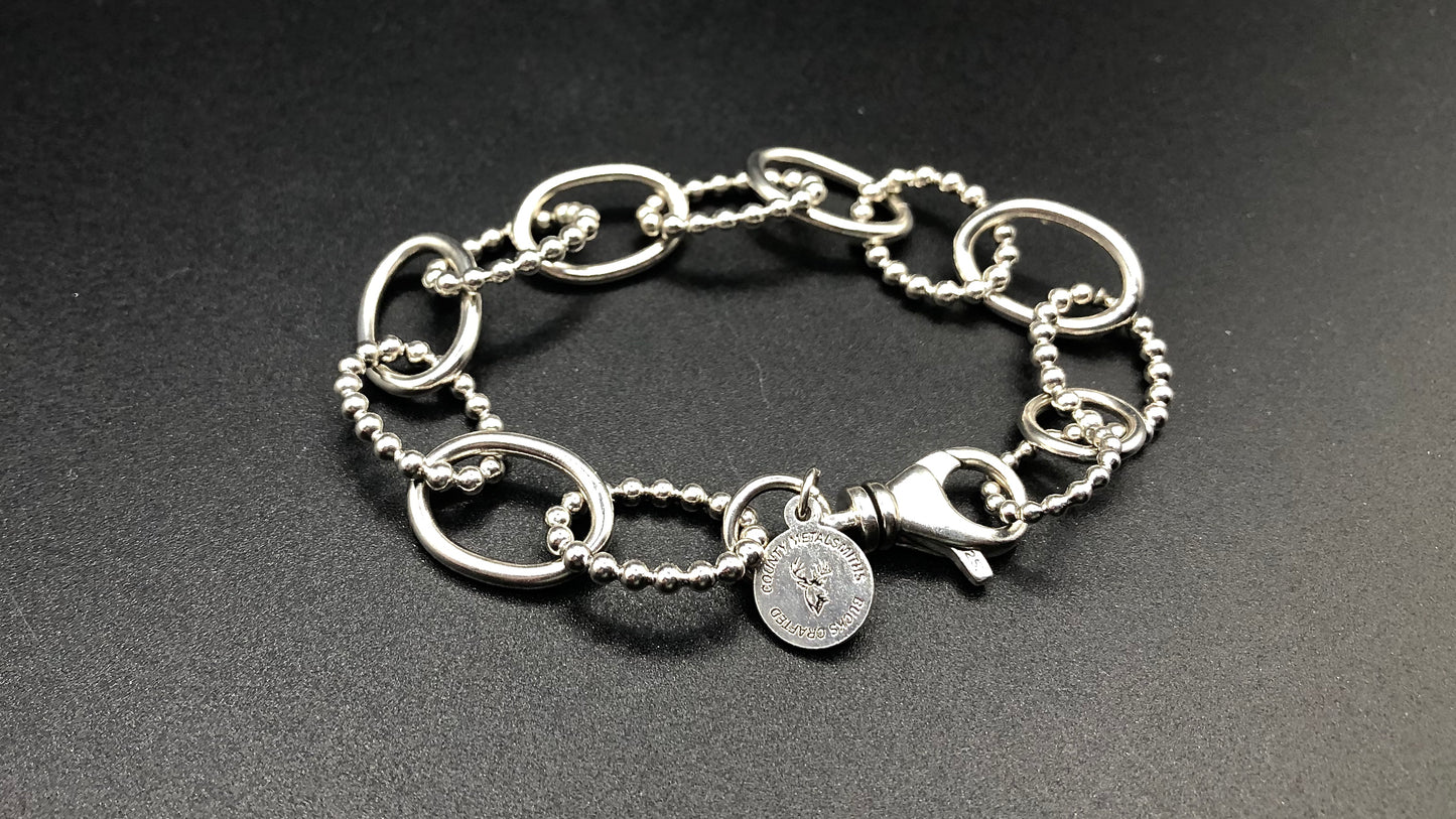 Hand crafted sterling silver high polished and beaded large oval link bracelet