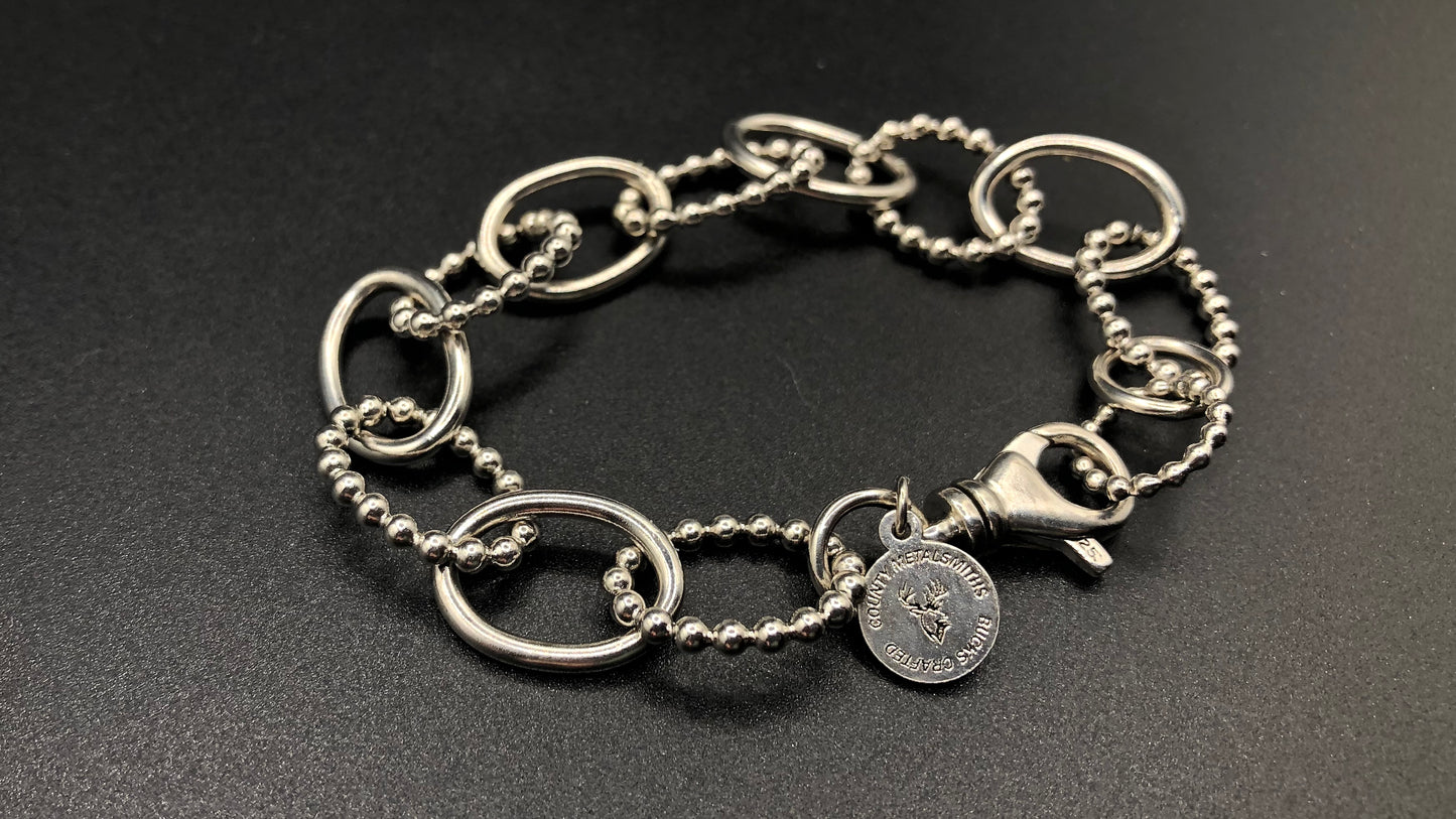 Hand crafted sterling silver high polished and beaded large oval link bracelet