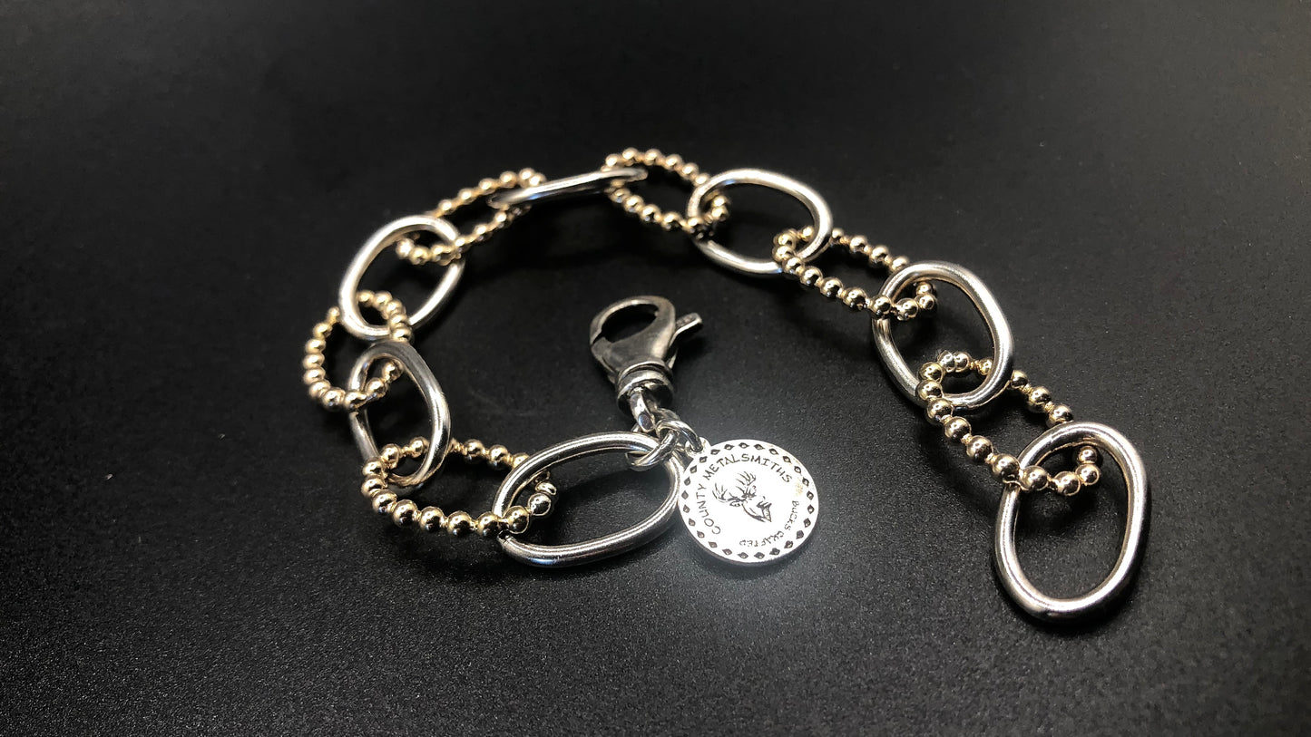 Hand crafted sterling silver high polish and 1/20 gold bead oval link bracelet