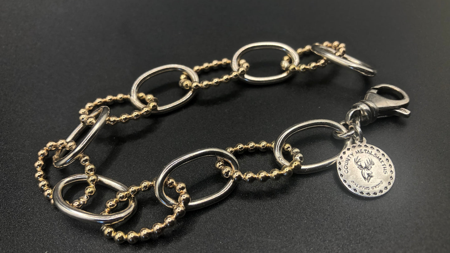 Hand crafted sterling silver high polish and 1/20 gold bead oval link bracelet