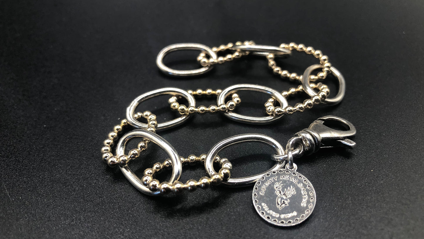 Hand crafted sterling silver high polish and 1/20 gold bead oval link bracelet