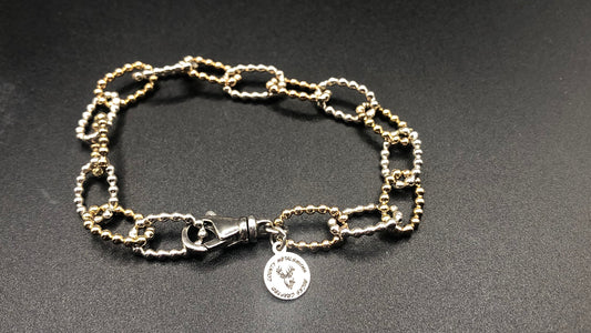 Hand crafted sterling silver and 1/20 14k oval beaded link bracelet