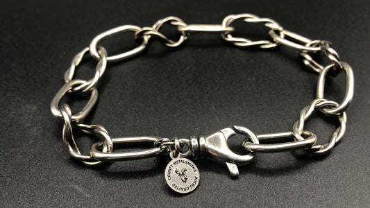 Hand crafted sterling silver oval twisted and oval high polished link bracelet