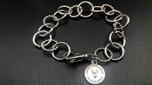 Hand crafted sterling silver high polished and beaded round link bracelet