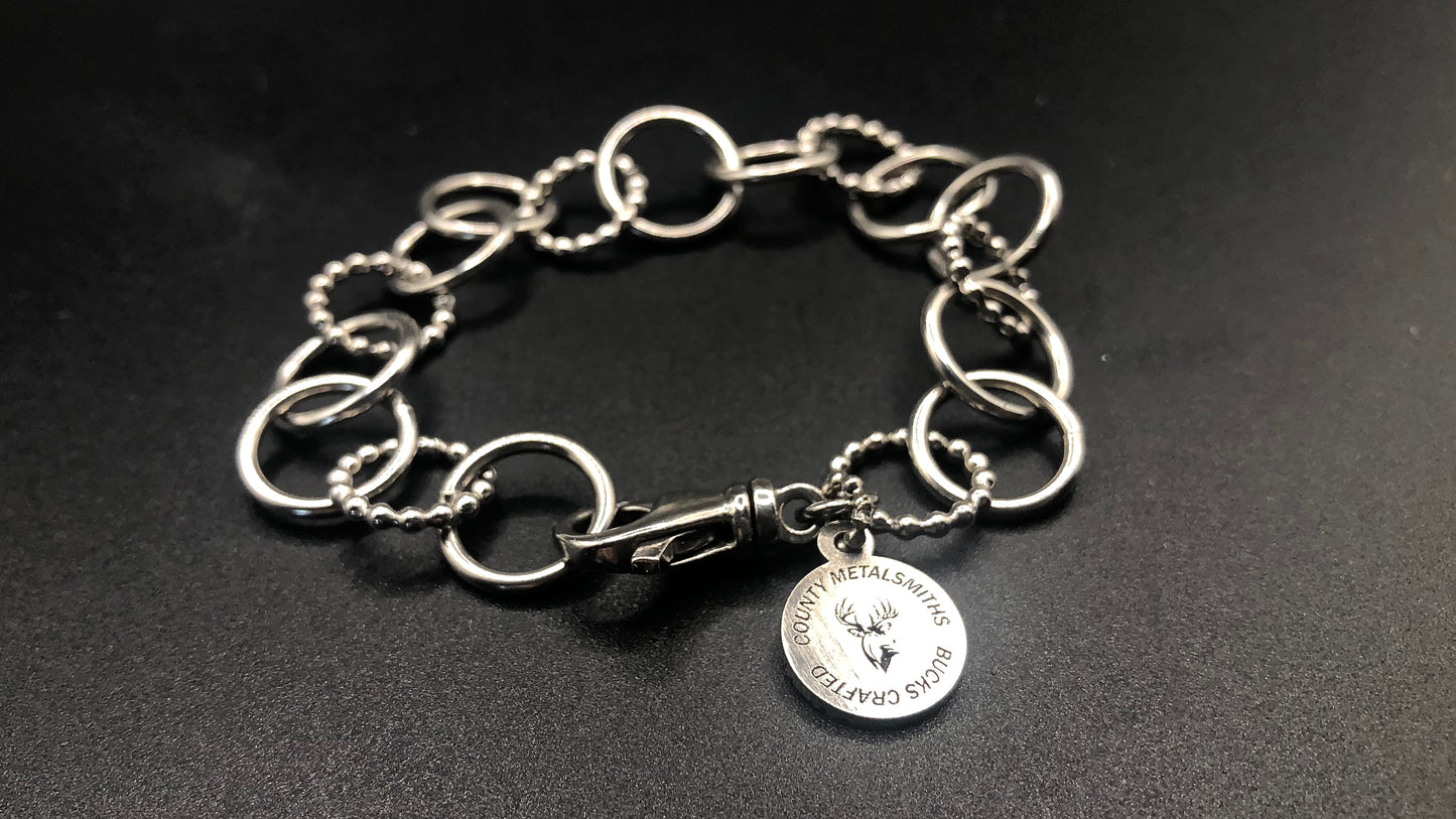 Hand crafted sterling silver high polished and beaded round link bracelet